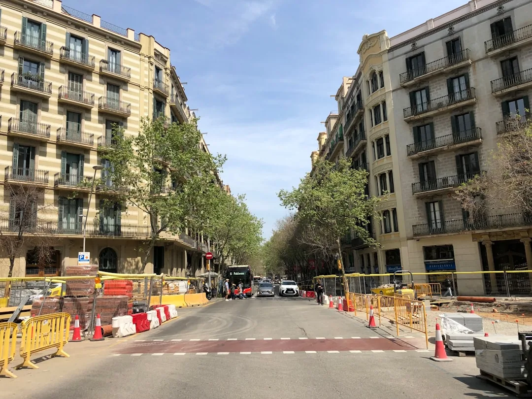 a city street with a construction zone in the foreground