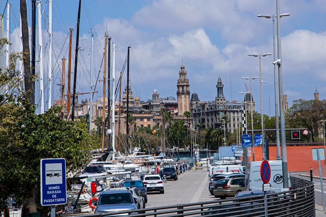 City street with cars, marina, and historic architecture