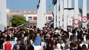 A large group of people walking down a street