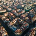 an aerial view of a city with lots of tall buildings