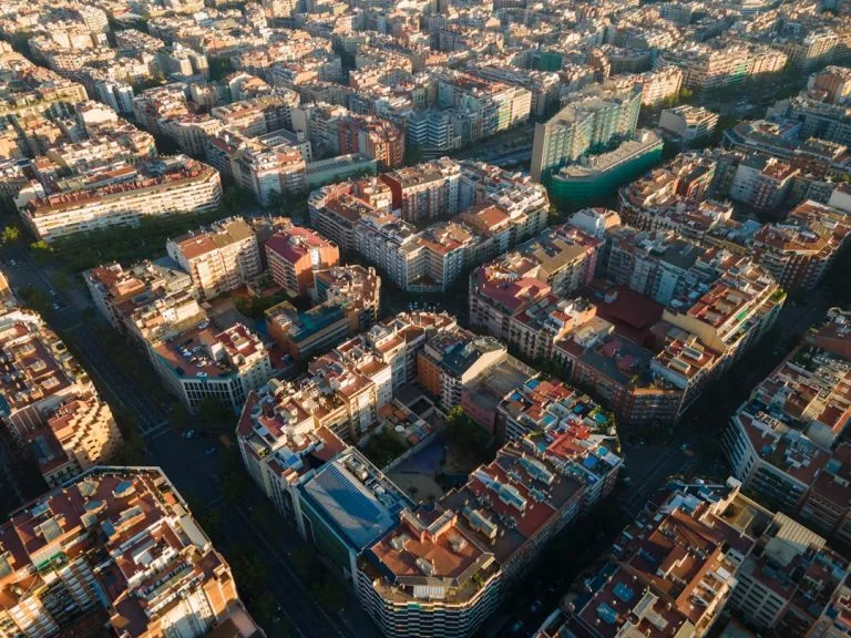 an aerial view of a city with lots of tall buildings