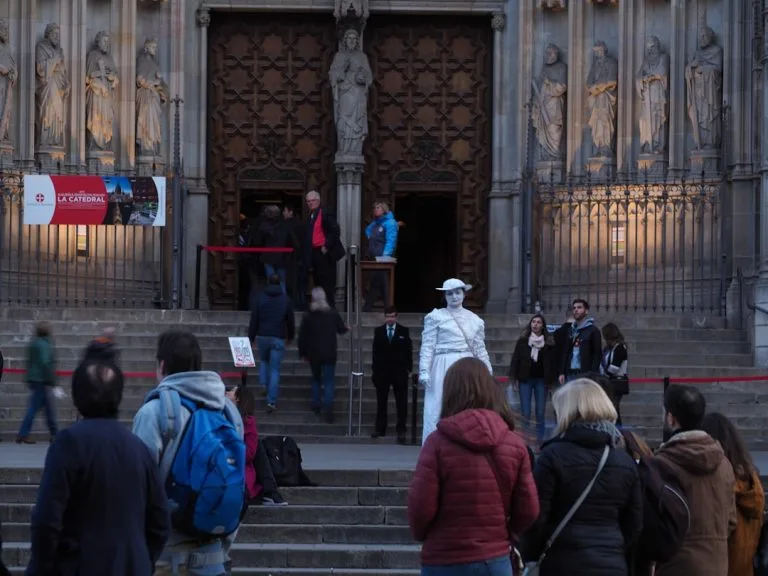 A group of people standing in front of a building