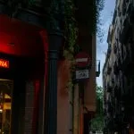 Neon sign for barcelona in a narrow street