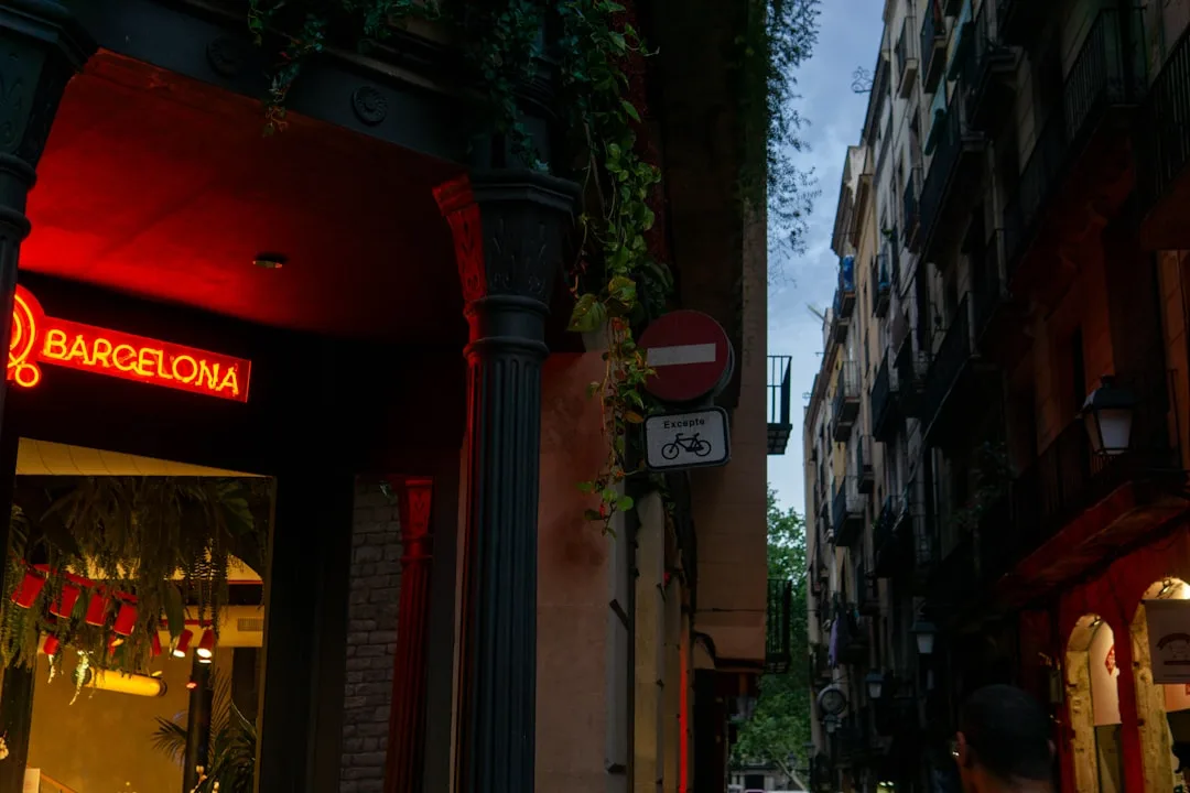 Neon sign for barcelona in a narrow street