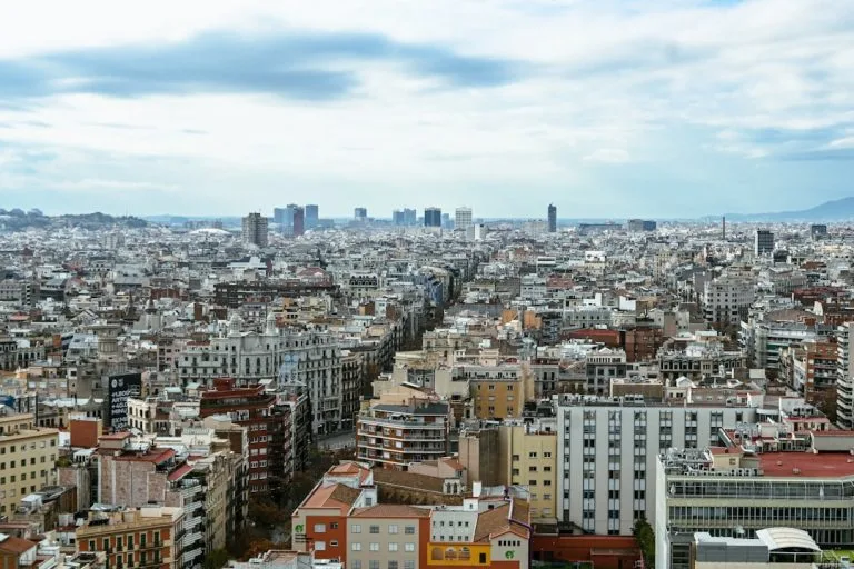 Expansive cityscape with dense buildings and distant skyscrapers