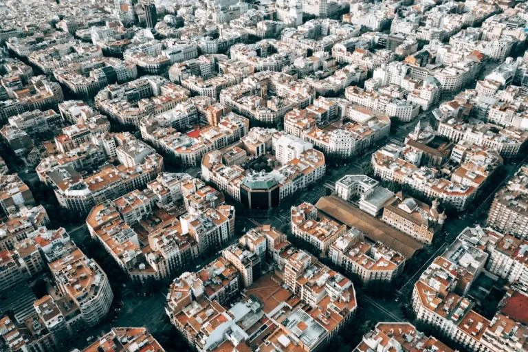 aerial photo of brown and white city buildings