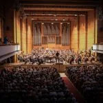 people watching orchestra