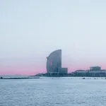 city skyline across body of water during daytime