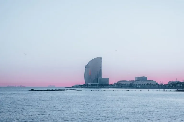city skyline across body of water during daytime