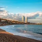 city skyline across the sea during daytime