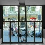 a person standing in front of a large window