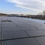 the roof of a building with a lot of solar panels on it