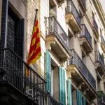 Catalan flag hanging from a balcony on a building